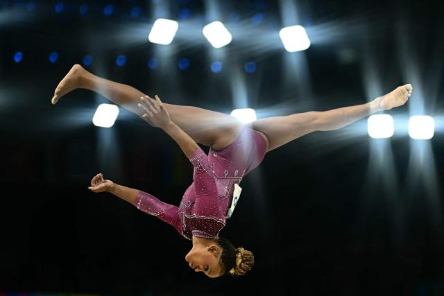 (FILES) Brazil's Rebeca Andrade competes in the artistic gymnastics women's balance beam final during the Paris 2024 Olympic Games at the Bercy Arena in Paris, on August 5, 2024. Brazilian Olympic champion Rebeca Andrade is back in action after taking a break to look after her health: on August 7, 2026, she achieved her best score of the year on the vault whilst competing in the Brazilian National Artistic Gymnastics Championships. (Photo by Loic VENANCE / AFP)