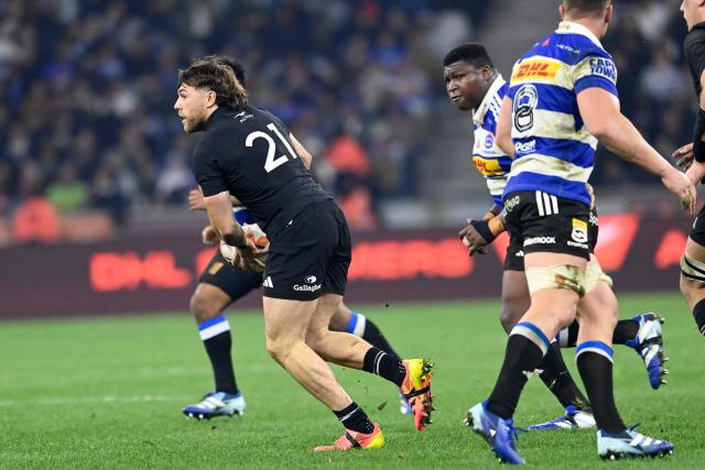 New Zealand's scrum-half Kyle Preston runs with the ball during a rugby union tour match between the Stormers and New Zealand at the Cape Town Stadium in Cape Town on August 7, 2026. (Photo by Rodger Bosch / AFP)