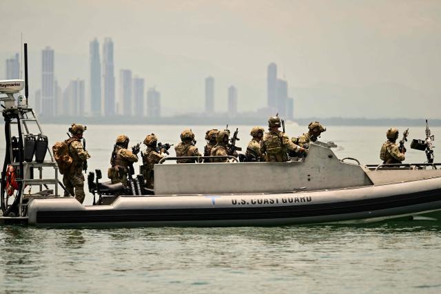 Soldiers from several countries take part in the multinational Panamax 2026 exercise at the Pacific entrance to the Panama Canal in Panama on August 7, 2026. The Panamax 2026 exercise brings together 1,700 military personnel from armed forces across the Americas, the Caribbean and Europe to strengthen regional cooperation and interoperability. (Photo by MARTIN BERNETTI / AFP)