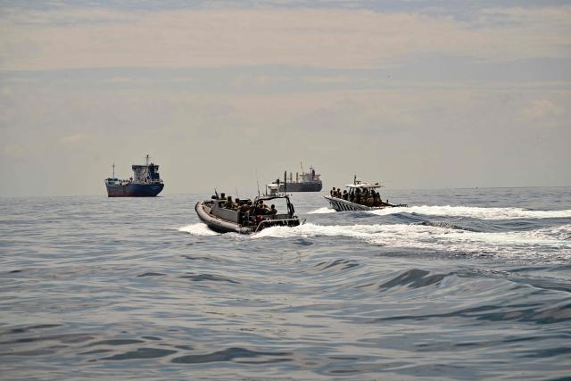 Soldiers from several countries take part in the multinational Panamax 2026 exercise at the Pacific entrance to the Panama Canal in Panama on August 7, 2026. The Panamax 2026 exercise brings together 1,700 military personnel from armed forces across the Americas, the Caribbean and Europe to strengthen regional cooperation and interoperability. (Photo by MARTIN BERNETTI / AFP)