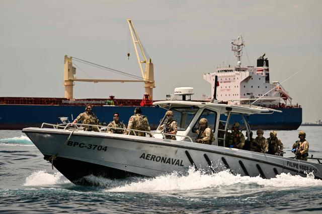 Soldiers from several countries take part in the multinational Panamax 2026 exercise at the Pacific entrance to the Panama Canal in Panama on August 7, 2026. The Panamax 2026 exercise brings together 1,700 military personnel from armed forces across the Americas, the Caribbean and Europe to strengthen regional cooperation and interoperability. (Photo by MARTIN BERNETTI / AFP)