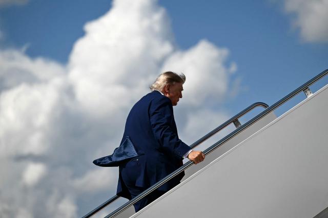 US President Donald Trump boards Air Force One at Joint Base Andrews, Maryland, on August 7, 2026 as he departs for his New Jersey golf club in Bedminster for the weekend. (Photo by Kent NISHIMURA / AFP)
