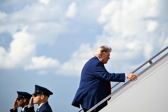 US President Donald Trump boards Air Force One at Joint Base Andrews, Maryland, on August 7, 2026 as he departs for his New Jersey golf club in Bedminster for the weekend. (Photo by Kent NISHIMURA / AFP)