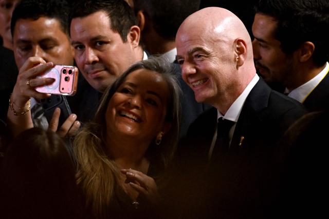 FIFA's president Gianni Infantino poses for a selfie with an attendee to the swearing-in ceremony of Colombia's new President Abelardo de la Espriella at Universidad Santiago de Cali in Cali, Colombia, on August 7, 2026. (Photo by Luis ACOSTA / AFP)