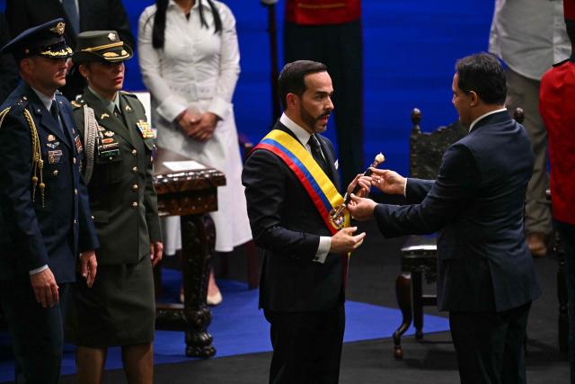 Colombia's new President Abelardo de la Espriella takes the oath of office in front of Colombian Congress President Honorio Henriquez during his inauguration ceremony at the Universidad Santiago de Cali in Cali, Colombia, on August 7, 2026. (Photo by Luis ACOSTA / AFP)