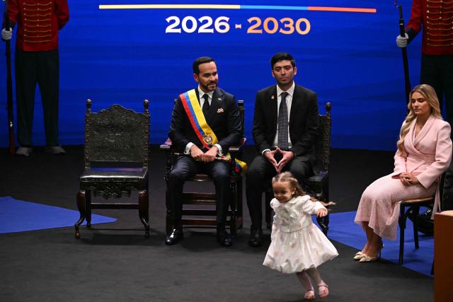 Colombia's new President Abelardo de la Espriella looks at his daughter Francesca next to President of the Chamber of Representatives of Colombia Nicolas Barguil and his wife Ana Lucia Pineda, during his inauguration ceremony at the Universidad Santiago de Cali in Cali, Colombia, on August 7, 2026. (Photo by Luis ACOSTA / AFP)