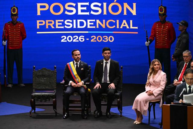 Colombia's new President Abelardo de la Espriella (L) listens to Colombian Congress President Honorio Henriquez (R) next to President of the Chamber of Representatives of Colombia Nicolas Barguil (2nd L) and his wife Ana Lucia Pineda (2nd R) during his inauguration ceremony at the Universidad Santiago de Cali in Cali, Colombia, on August 7, 2026. (Photo by Luis ACOSTA / AFP)