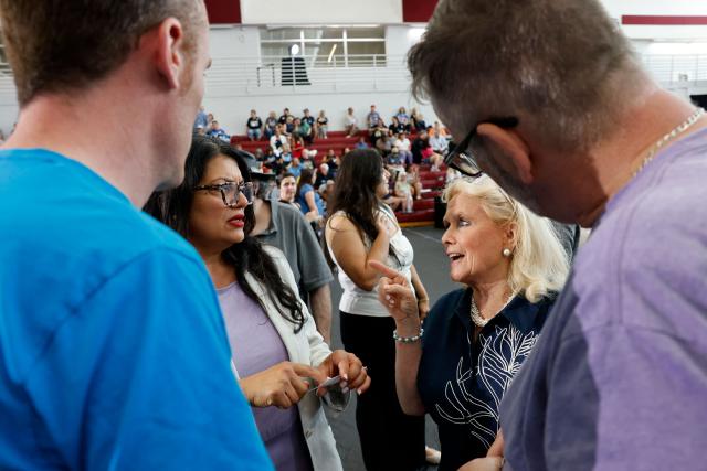 US Rep. Debbie Dingell (D-MI) (2R) and US Rep. Rashida Tlaib (D-MI) (2nd L) attend a General Election Kickoff Rally at Renaissance High School in Detroit, Michigan, on August 7, 2026. (Photo by JEFF KOWALSKY / AFP)