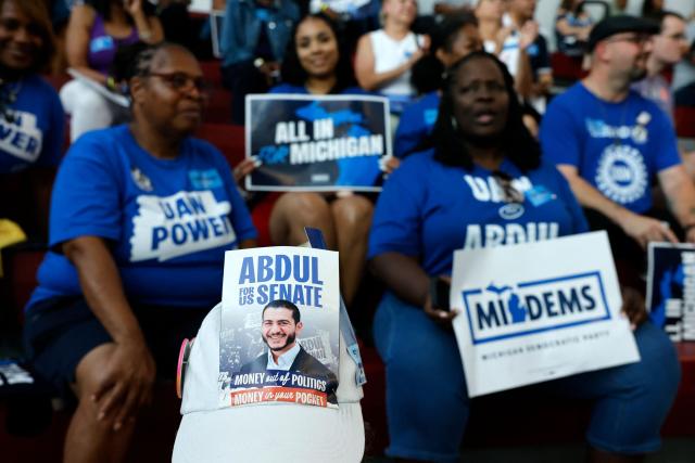 An attendee wears a sign on their hat featuring US Democratic Senate candidate from Michigan, Abdul El-Sayed, before the Michican Democratic Party General Election Kickoff Rally at Renaissance High School in Detroit, Michigan, on August 7, 2026. (Photo by JEFF KOWALSKY / AFP)