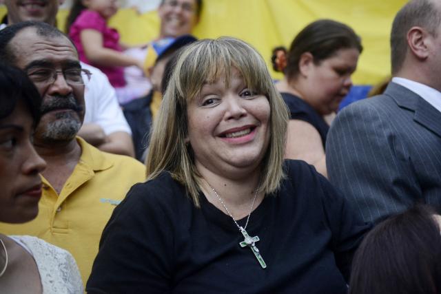 (FILES) Judge Maria Afiuni smiles outside her residence in Caracas on June 14, 2013. Former Venezuelan judge Maria Lourdes Afiuni was granted full freedom after years under house arrest for political reasons, her family said on August 8, 2026, after calling the previous day for her case to be closed due to the serious illness she suffers from. (Photo by Leo RAMIREZ / AFP)
