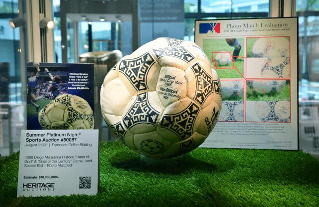 The ball that was used in the 1986 World Cup match between Argentina and England during which Argentina's Diego Maradona scored the "Hand of God" goal is displayed before auction at Heritage Auctions in Beverly Hills, California, on August 7, 2026. The ball that Maradona used to score his infamous "Hand of God" goal is expected to sell for $10 million at a US auction this month. Maradona's goal in the quarter-final match at the Estadio Azteca saw him punch the ball past the England goalkeeper, with the South Americans ultimately winning 2-1. (Photo by Frederic J. BROWN / AFP)