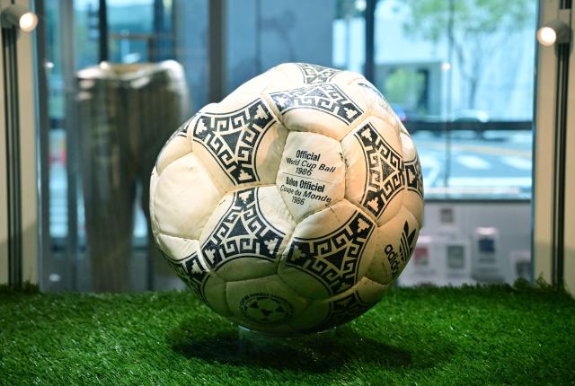 The ball that was used in the 1986 World Cup match between Argentina and England during which Argentina's Diego Maradona scored the "Hand of God" goal is displayed before auction at Heritage Auctions in Beverly Hills, California, on August 7, 2026. The ball that Maradona used to score his infamous "Hand of God" goal is expected to sell for $10 million at a US auction this month. Maradona's goal in the quarter-final match at the Estadio Azteca saw him punch the ball past the England goalkeeper, with the South Americans ultimately winning 2-1. (Photo by Frederic J. BROWN / AFP)