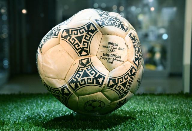The ball that was used in the 1986 World Cup match between Argentina and England during which Argentina's Diego Maradona scored the "Hand of God" goal is displayed before auction at Heritage Auctions in Beverly Hills, California, on August 7, 2026. The ball that Maradona used to score his infamous "Hand of God" goal is expected to sell for $10 million at a US auction this month. Maradona's goal in the quarter-final match at the Estadio Azteca saw him punch the ball past the England goalkeeper, with the South Americans ultimately winning 2-1. (Photo by Frederic J. BROWN / AFP)