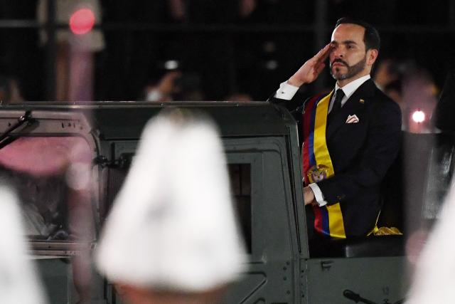 Colombia's new President Abelardo de la Espriella rides in a military vehicle while reviewing troops during a change-of-command ceremony at the Pichincha Battalion following his inauguration in Cali, Colombia, on August 7, 2026. (Photo by Jaime SALDARRIAGA / AFP)