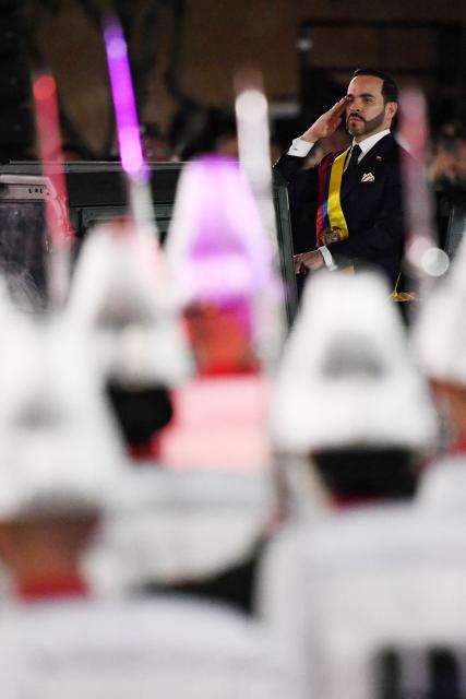 Colombia's new President Abelardo de la Espriella rides in a military vehicle while reviewing troops during a change-of-command ceremony at the Pichincha Battalion following his inauguration in Cali, Colombia, on August 7, 2026. (Photo by Jaime SALDARRIAGA / AFP)