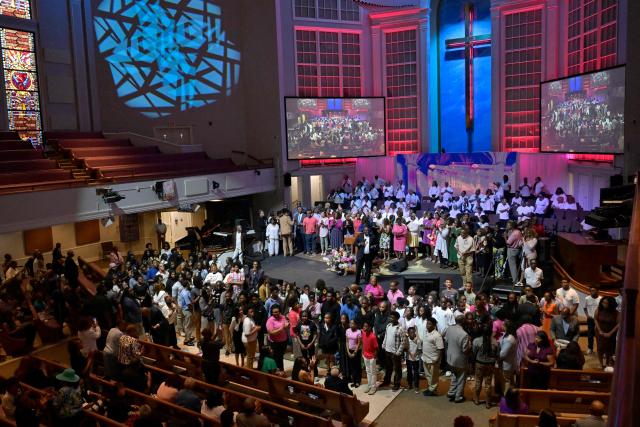 Educators join Pastor Dr. J. Lawrence Turner on stage during the final Sunday service before public schools reopen following the summer break at Mississippi Boulevard Christian Church in Memphis, Tennessee, on August 2, 2026. Like every Saturday during election season, the Black Clergy Collaborative, an organization that brings together dozens of Black churches in Memphis, organizes door-to-door campaigns in the city’s African American neighborhoods to encourage residents to vote. The city’s Black clergy, in the place where Martin Luther King was assassinated in 1968, is redoubling its efforts to mobilize African American voters, in the hope of sending a Democratic representative to the United States Congress. (Photo by Brandon DILL / AFP)