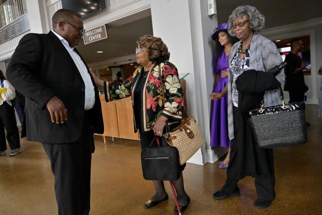 Pastor Dr. J. Lawrence Turner (L) speaks with congregants following Sunday service at Mississippi Boulevard Christian Church in Memphis, Tennessee, on August 2, 2026. Like every Saturday during election season, the Black Clergy Collaborative, an organization that brings together dozens of Black churches in Memphis, organizes door-to-door campaigns in the city’s African American neighborhoods to encourage residents to vote. The city’s Black clergy, in the place where Martin Luther King was assassinated in 1968, is redoubling its efforts to mobilize African American voters, in the hope of sending a Democratic representative to the United States Congress. (Photo by Brandon DILL / AFP)