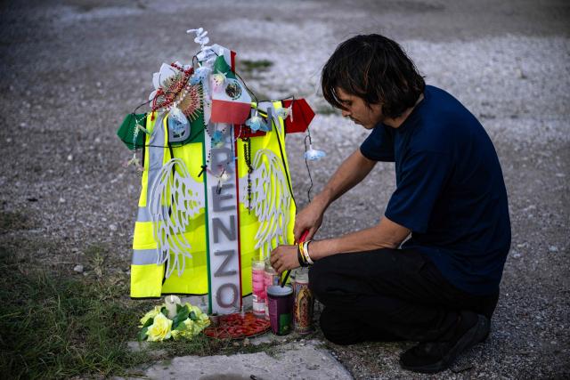 A man lits a candle during a vigil and celebration of life for Lorenzo Salgado Araujo, a 52-year-old Mexican construction worker who was fatally shot during a US Immigration and Customs Enforcement (ICE) operation, in Houston, Texas, on August 7, 2026. The son of a Mexican man fatally shot by US immigration officials in Texas demanded an investigation, with a leading civil rights group calling it a "possible murder." Lorenzo Salgado was killed by an ICE officer in Houston, Texas, early on July 7, marking the first fatal shooting involving US immigration officers since two January killings in the northern city of Minneapolis that drew national headlines. (Photo by RONALDO SCHEMIDT / AFP)