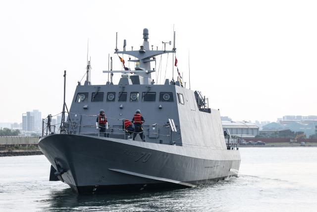 A Kuang Hua VI-class missile boat makes an emergency departure from a naval base during the annual Han Kuang military exercises at a navy base as part of annual Han Kuang military exercise in Kaohsiung on August 8, 2026. (Photo by I-Hwa Cheng / AFP)