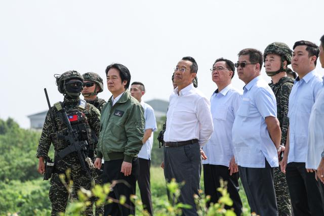 Taiwan's President Lai Ching-te (2nd-L) and Defence Minister Wellington Koo (3rd-L) inspect a drone operation at a navy base during annual Han Kuang military exercise in Kaohsiung on August 8, 2026. (Photo by I-Hwa Cheng / AFP)