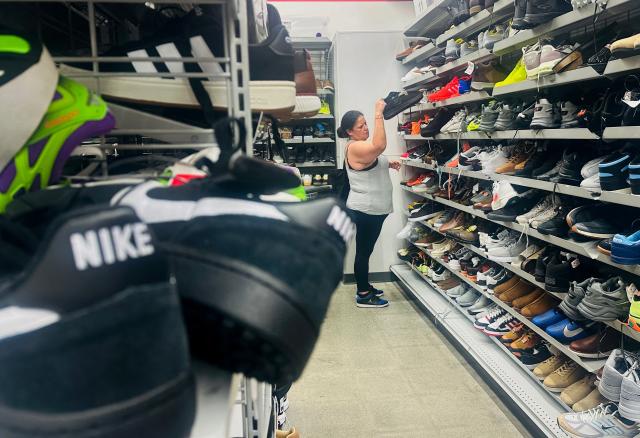 A woman shops for shoes in La Puente, California, on August 7, 2026. The US unexpectedly lost thousands of jobs in July, government data showed on August 7, a blow to President Donald Trump's claims of leading an economic revival as his Republican Party gears up for crucial midterm elections. The world's largest economy lost 23,000 jobs in July, data published by the US Bureau of Labor Statistics showed, signalling potential labor market weakness after months of steady growth. (Photo by Frederic J. BROWN / AFP)