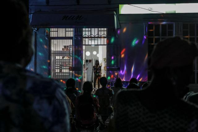 A mannequin displays an outfit from a local boutique during a fashion show, in the city of Sao Tome, capital of Sao Tome and Principe, on August 7, 2026. (Photo by Daniel BELOUMOU OLOMO / AFP)