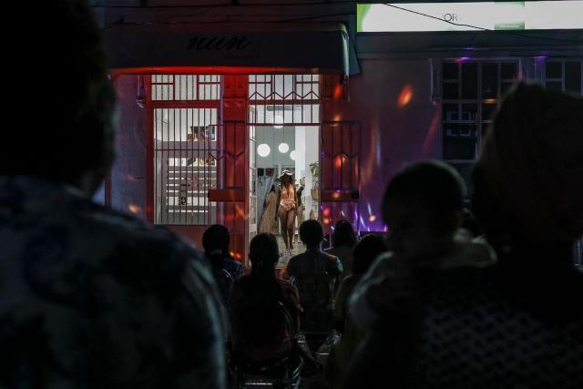 A mannequin displays an outfit from a local boutique during a fashion show, in the city of Sao Tome, capital of Sao Tome and Principe, on August 7, 2026. (Photo by Daniel BELOUMOU OLOMO / AFP)