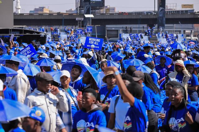 Democratic Alliance (DA) supporters gather in Johannesburg on August 8, 2026 during the party Manifesto launch ahead of November 2026 South Africa local elections. (Photo by MZINGENKOSI SIBANDA / AFP)