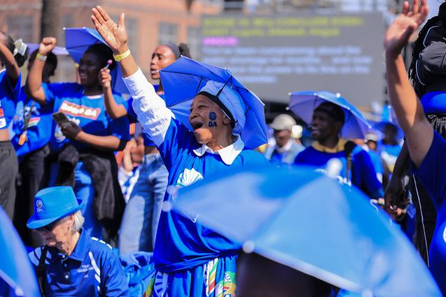 Democratic Alliance (DA) supporters sing as they gather in Johannesburg on August 8, 2026 during the party Manifesto launch ahead of November 2026 South Africa local elections. (Photo by MZINGENKOSI SIBANDA / AFP)