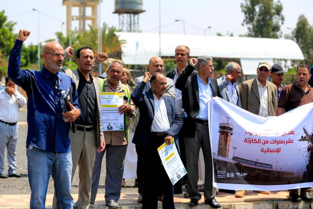 Demonstrators attend a protest at Sanaa International Airport on August 8, 2026 against restrictions imposed by the Saudi-led coalition on Yemeni airports and demanding the reopening of the facility and resumption of commercial flights to the Yemeni capital. (Photo by Mohammed HUWAIS / AFP)