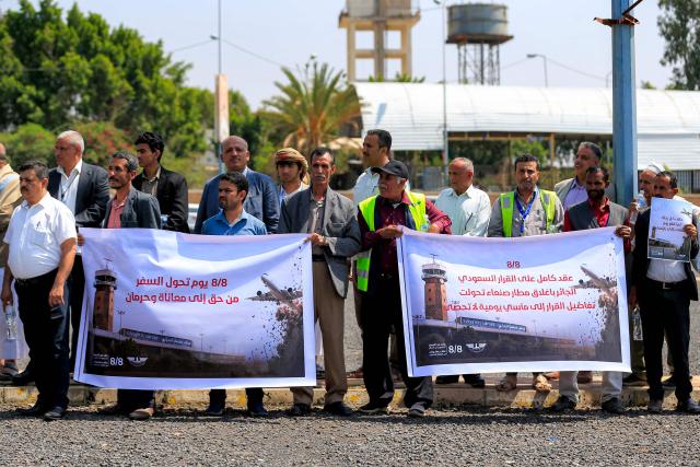 Demonstrators attend a protest at Sanaa International Airport on August 8, 2026 against restrictions imposed by the Saudi-led coalition on Yemeni airports and demanding the reopening of the facility and resumption of commercial flights to the Yemeni capital. (Photo by Mohammed HUWAIS / AFP)
