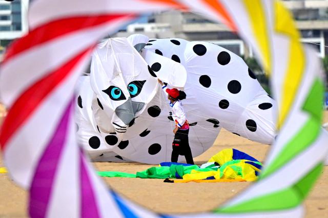 A participant takes part in the International Kite Festival in Colombo on August 8, 2026. (Photo by Ishara S. KODIKARA / AFP)