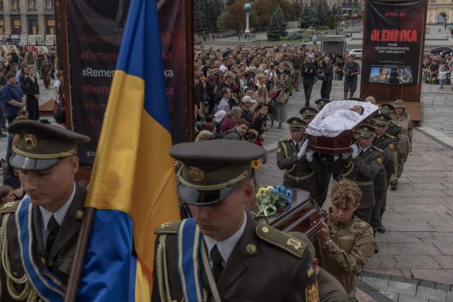 EDITORS NOTE: Graphic content / Ukrainian military members carry the coffin of Oleksiy Yukov, head of the Ukrainian platsdarm search unit, during the funeral service in Independence Square in Kyiv on August 8, 2026, amid the Russian invasion of Ukraine. For years, Oleksiy Yukov walked the boundary between the living and the dead as he led a group of volunteers retrieving corpses in the most dangerous parts of Ukraine's front. He was killed on August 5, 2026 during what would be his last search mission, the news of his death triggering an outpour of grief, especially in the eastern Ukraine, where he had become a familiar figure, often appearing in the moments of grief that have come to define life the Donetsk region, battered by years of Russian assaults. (Photo by Roman PILIPEY / AFP)