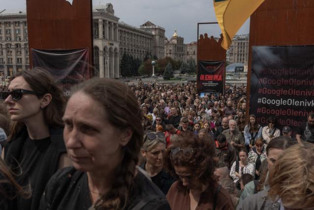 People attend the funeral of Oleksiy Yukov, head of the Ukrainian platsdarm search unit, in Independence Square in Kyiv on August 8, 2026, amid the Russian invasion of Ukraine. For years, Oleksiy Yukov walked the boundary between the living and the dead as he led a group of volunteers retrieving corpses in the most dangerous parts of Ukraine's front. He was killed on August 5, 2026 during what would be his last search mission, the news of his death triggering an outpour of grief, especially in the eastern Ukraine, where he had become a familiar figure, often appearing in the moments of grief that have come to define life the Donetsk region, battered by years of Russian assaults. (Photo by Roman PILIPEY / AFP)