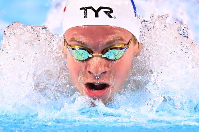(FILES) France's swimmer Leon Marchand competes in a heat of the men's 400m individual medley swimming event during the 2025 World Aquatics Championships in Singapore on August 3, 2025. Leon Marchand has withdrawn from the 200m and 400m individual medley swimming events of the LEN European Aquatics Championships due to insufficient recovery from an adductor muscle injury, the French Swimming Federation announced in a statement on August 8, 2026. Swimming events of the European Aquatics Championships are held from August 10 to 16. (Photo by MANAN VATSYAYANA / AFP)