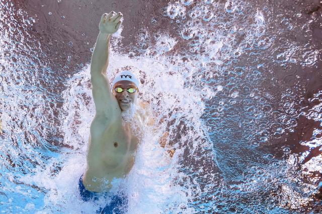 (FILES) France's swimmer Leon Marchand competes in a semi-final of the men's 200m individual medley swimming event during the 2025 World Aquatics Championships in Singapore on July 30, 2025. Leon Marchand has withdrawn from the 200m and 400m individual medley swimming events of the LEN European Aquatics Championships due to insufficient recovery from an adductor muscle injury, the French Swimming Federation announced in a statement on August 8, 2026. Swimming events of the European Aquatics Championships are held from August 10 to 16. (Photo by François-Xavier MARIT / AFP)