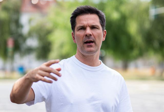Steffen Krach, the Social Democratic Party's (SPD) main candidate in upcoming regional elections in Berlin, reacts as he speaks to reporters during a campaign stop in Berlin's Wedding district on August 8, 2026. Berlin goes to the polls on September 20, 2026. (Photo by John MACDOUGALL / AFP)