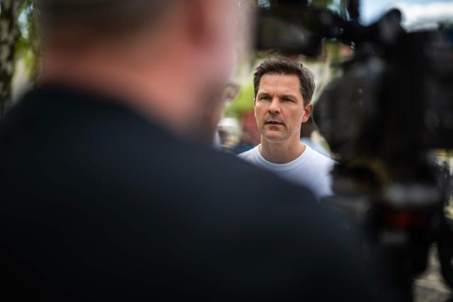 Steffen Krach, the Social Democratic Party's (SPD) main candidate in upcoming regional elections in Berlin, speaks to reporters during a campaign stop in Berlin's Wedding district on August 8, 2026. Berlin goes to the polls on September 20, 2026. (Photo by John MACDOUGALL / AFP)