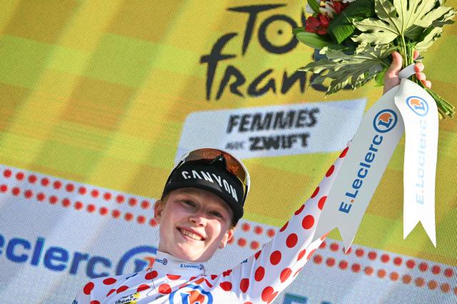 Fenix-Deceuninck's Dutch rider Puck Pieterse celebrates on the podium wearing the best climber's polka dot (dotted) jersey after the 8th (out of 9) stage of the fifth edition of the Women's Tour de France cycling race, 171.9 km from Sisteron to Nice, in Nice, southeastern France on August 8, 2026. (Photo by NICOLAS TUCAT / AFP)
