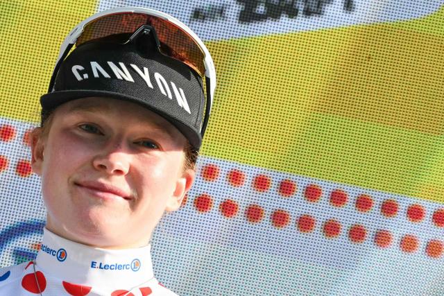 Fenix-Deceuninck's Dutch rider Puck Pieterse celebrates on the podium wearing the best climber's polka dot (dotted) jersey after the 8th (out of 9) stage of the fifth edition of the Women's Tour de France cycling race, 171.9 km from Sisteron to Nice, in Nice, southeastern France on August 8, 2026. (Photo by NICOLAS TUCAT / AFP)
