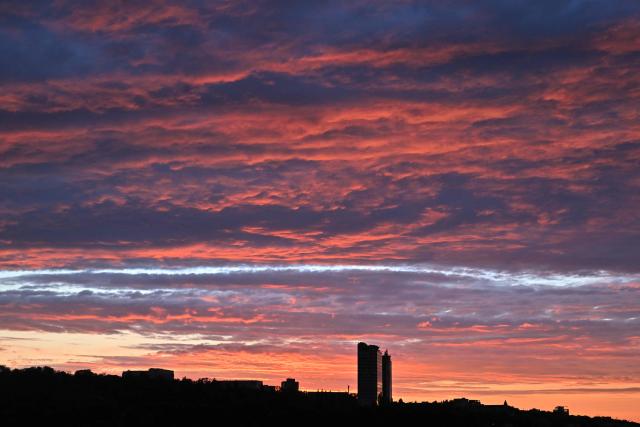 This photograph shows colours in the sky during sunset in the Ukrainian capital Kyiv after stormy day on August 8, 2026, amid the Russian invasion in Ukraine. (Photo by Sergei SUPINSKY / AFP)