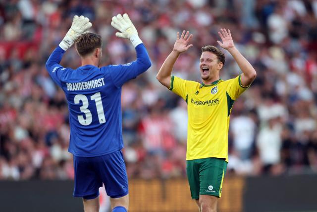 Fortuna Sittard's Dutch goalkeeper #31 Mattijs Branderhorst (L) and Fortuna Sittard's Dutch defender #06 Syb van Ottele (R) celebrate their team's first goal during the Dutch Eredivisie football match between PSV Eindhoven and Fortuna Sittard at the Philips Stadium in Eindhoven on August 8, 2026. (Photo by Sonny Lensen / ANP / AFP) / Netherlands OUT