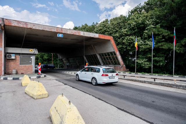 A motorist drives at the Kardam border-crossing between Bulgaria and Romania, near the location where a drone that entered Bulgaria exploded in a farmland area, on August 8, 2026. Ukraine on August 8 denied targeting Bulgaria after a drone exploded close to the strategic Trans-Balkan gas pipeline linking Turkey to Ukraine near the Romanian border. (Photo by Mihail IVANOV / AFP)