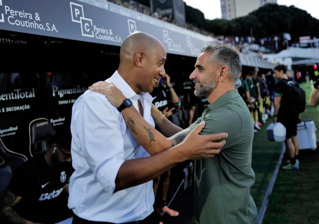 Estrela da Amadora's Portuguese coach Pepa (L) and Sporting Lisbon's Portuguese coach Rui Borges greet each other before the Portuguese League football match between CF Estrela da Amadora and Sporting CP at Jose Gomes stadium in Amadora on August 8, 2026. (Photo by Filipe AMORIM / AFP)