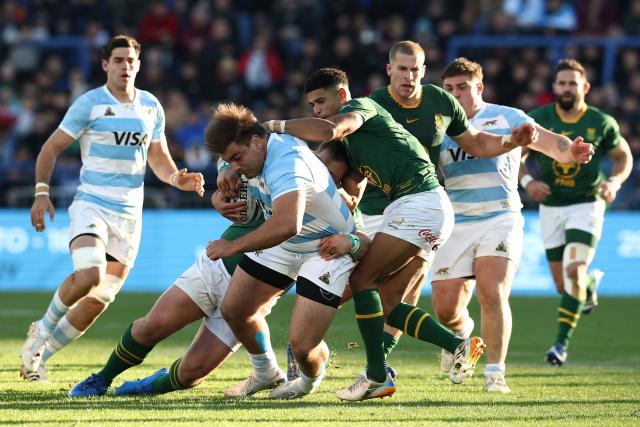 Argentina's prop Tomas Rapetti is tacked by South Africa's Boan Venter and South Africa's fly half Sacha Feinberg-Mngomezulu during a Rugby Union one-off test match between Argentina and South Africa at the Jose Amalfitani stadium in Buenos Aires on August 8, 2026. (Photo by Alejandro PAGNI / AFP)