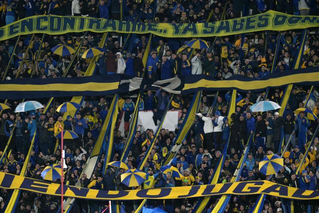 Boca Juniors' fans cheer for their team during the Argentine first division football match between Boca Juniors and Velez Sarsfield at the Tomas Adolfo Duco stadium in Buenos Aires on August 8, 2026. (Photo by JUAN MABROMATA / AFP)