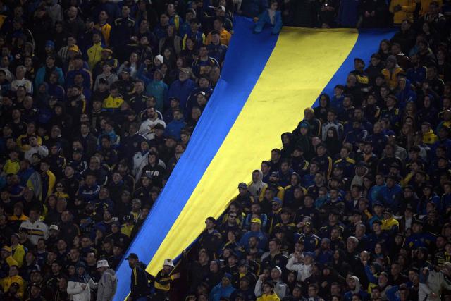 Boca Juniors' fans cheer for their team during the Argentine first division football match between Boca Juniors and Velez Sarsfield at the Tomas Adolfo Duco stadium in Buenos Aires on August 8, 2026. (Photo by JUAN MABROMATA / AFP)