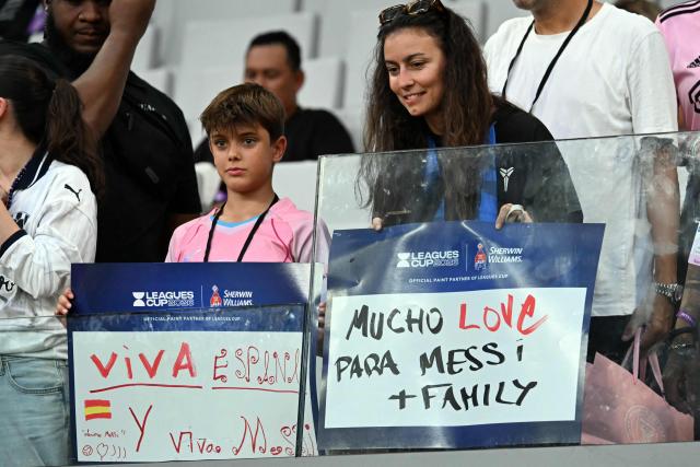 Inter Miami fans hold signs with messages for Argentine forward Lionel Messi ahead of the Leagues Cup 2026 group-stage football match between Inter Miami CF and Monterrey at Nu Stadium in Miami, Florida, on August 8, 2026. Jorge Messi, the father and agent of Lionel Messi, has died aged 68 in Rosario, Argentina, the eight-time Ballon d'Or winner's childhood club Newell's Old Boys announced on August 8. (Photo by CHANDAN KHANNA / AFP)