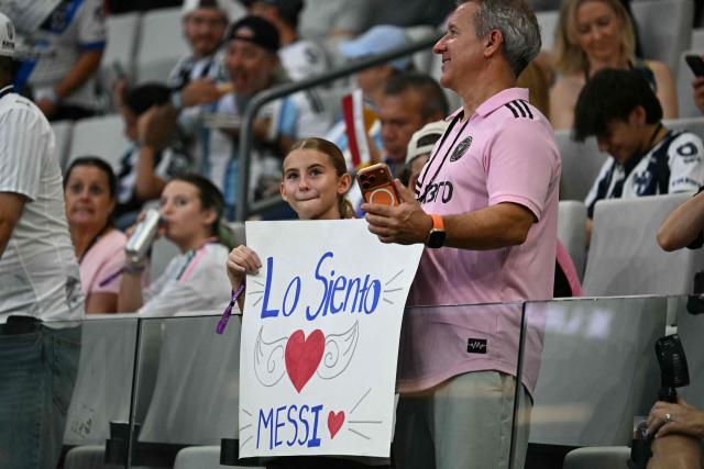 Inter Miami fans hold a sign with a message to Argentine forward Lionel Messi ahead of the Leagues Cup 2026 group-stage football match between Inter Miami CF and Monterrey at Nu Stadium in Miami, Florida, on August 8, 2026. Jorge Messi, the father and agent of Lionel Messi, has died aged 68 in Rosario, Argentina, the eight-time Ballon d'Or winner's childhood club Newell's Old Boys announced on August 8. (Photo by CHANDAN KHANNA / AFP)