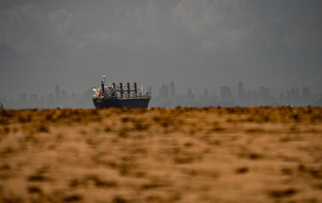 A cargo ship waits before entering the Panama Canal in Panama City on August 8,2026. (Photo by MARTIN BERNETTI / AFP)